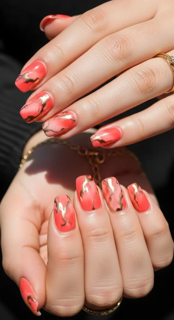Coral gold marble nails