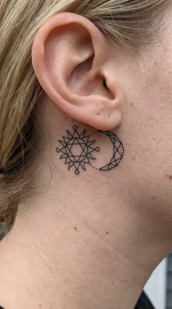 Geometric sun moon ear tattoo
