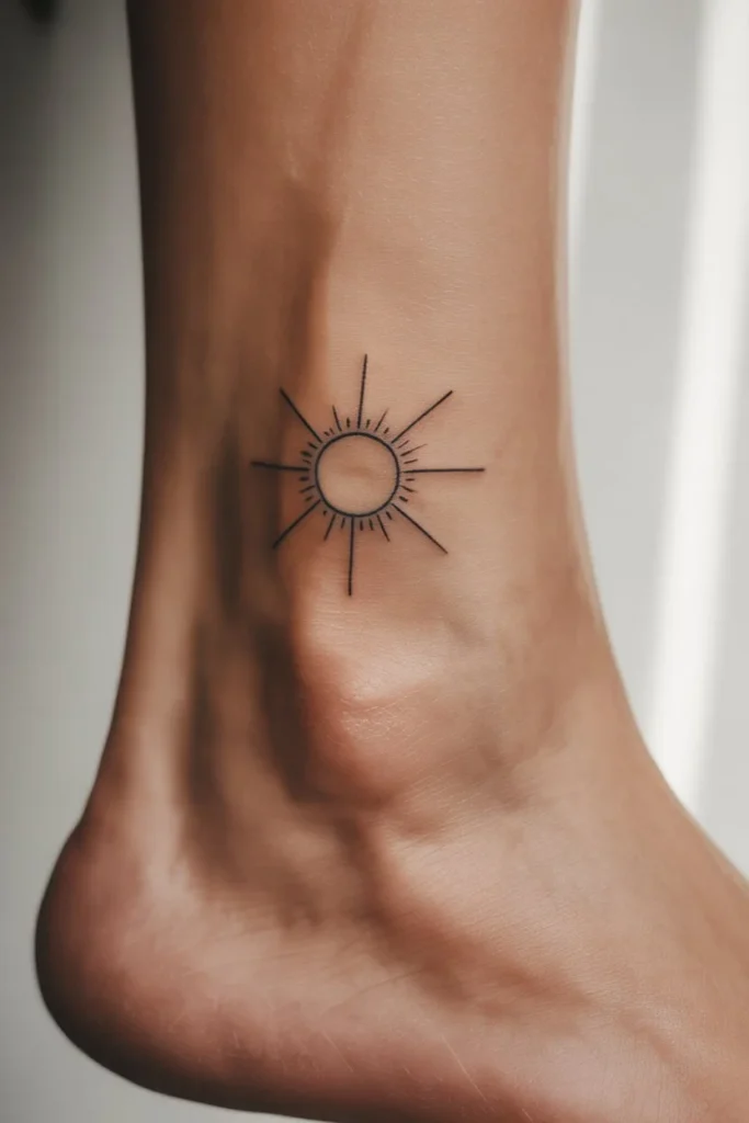 minimalist sun ankle tattoo
