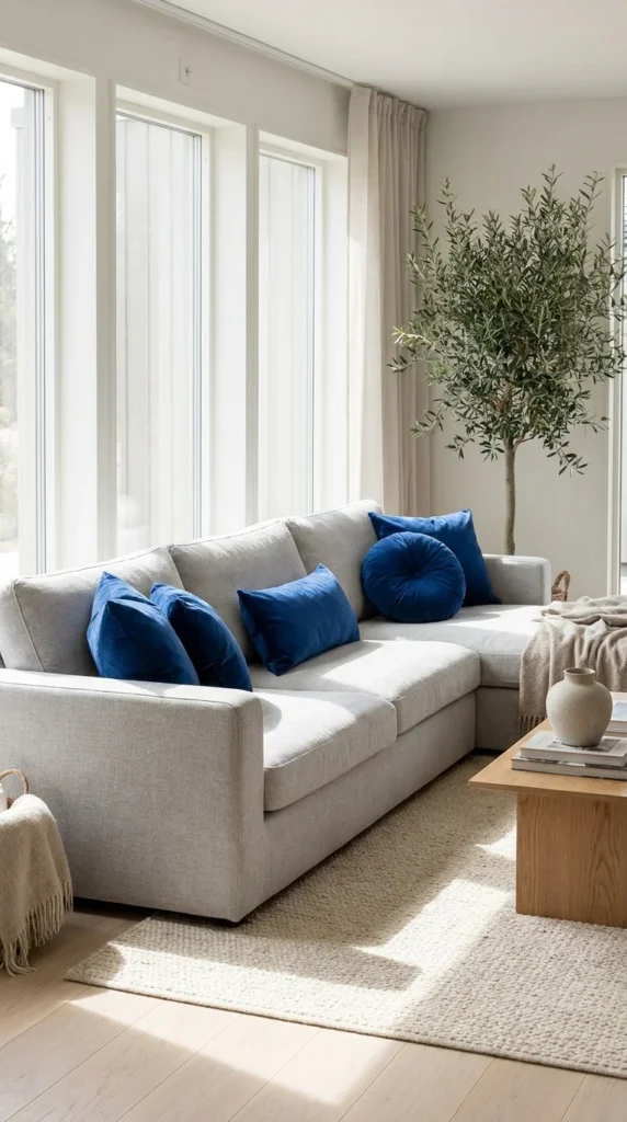 Grey sectional blue pillows